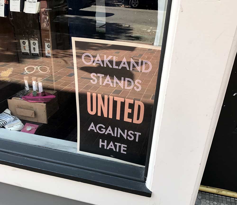Sign in Oakland Storefront: Oakland Stands United Against Hate