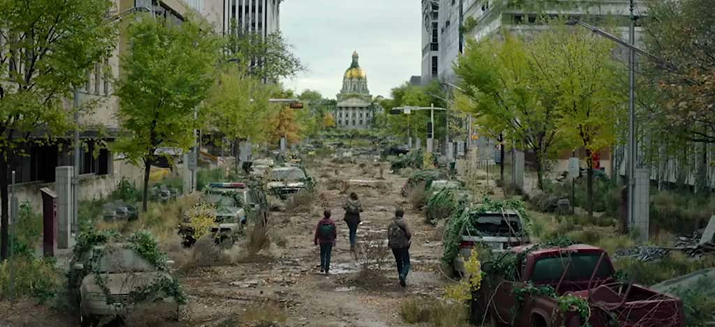 Three people walking through the post-apocalyptic streets of Boston