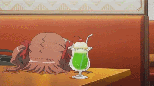 Anime character bangs their head on a table in a diner with a green ice cream soda beverage next to them.