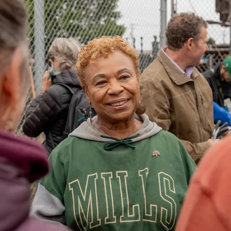 Barbara Lee wearing a Mills College hoodie at an event in Oakland