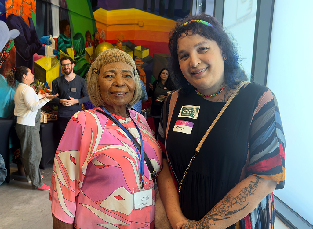 Corry Frydlewicz and Nellie Hannon smiling for a photo at the ECAP grand opening event
