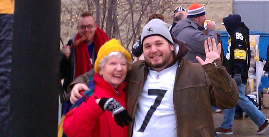 Mary and Corry pose for a photo in front of the Heinz Field entrance