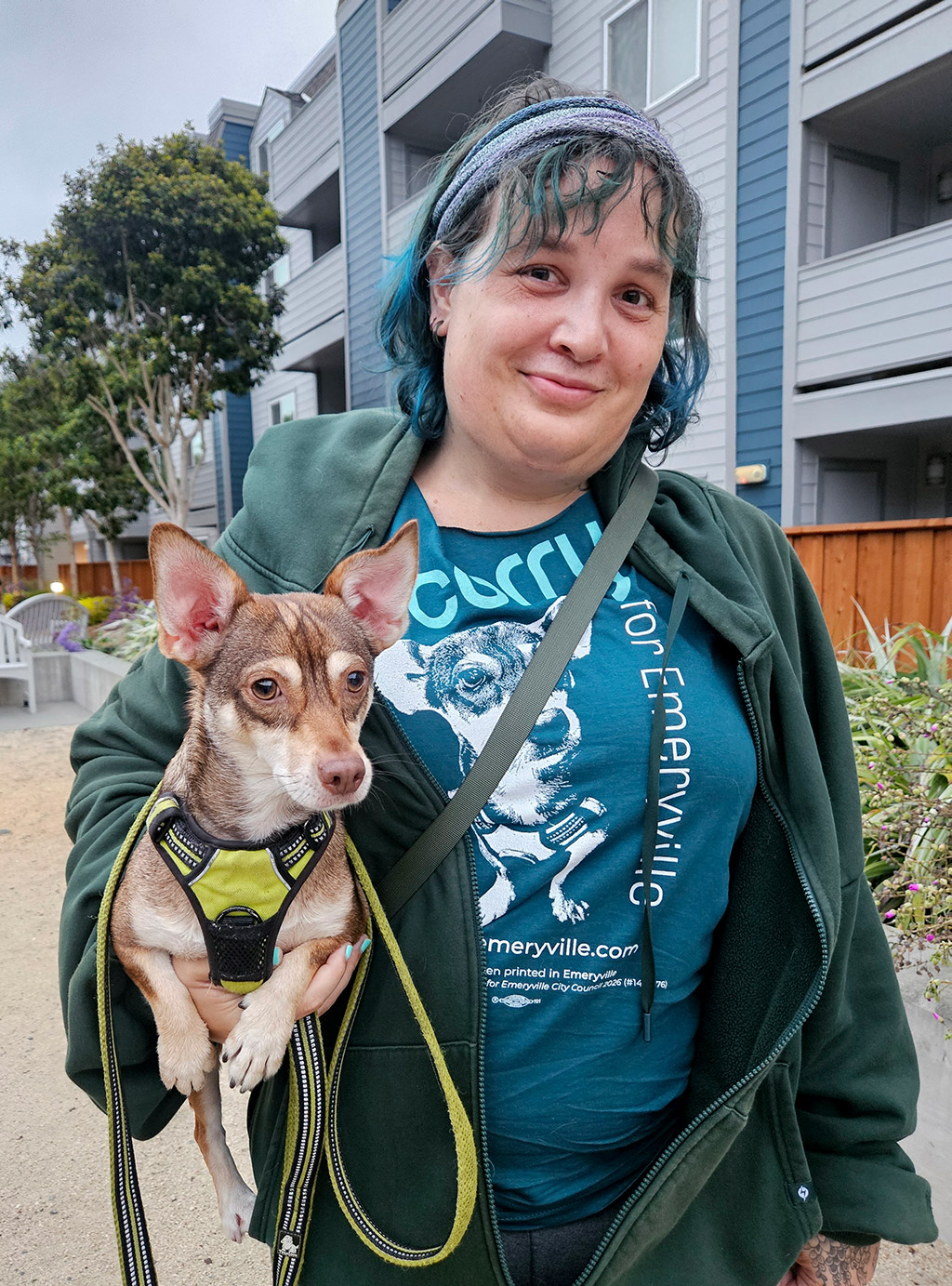 Corry holding Rogue while wearing her city council campaign tee shirt with Rogue on it.
