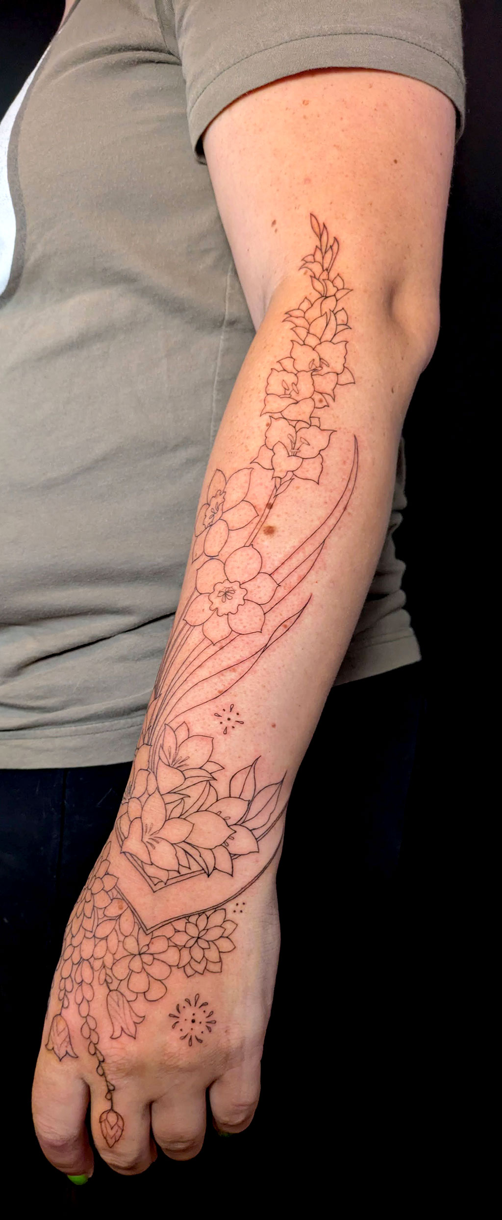 Corry's forearm tattoo progress photo of finished linework before shading