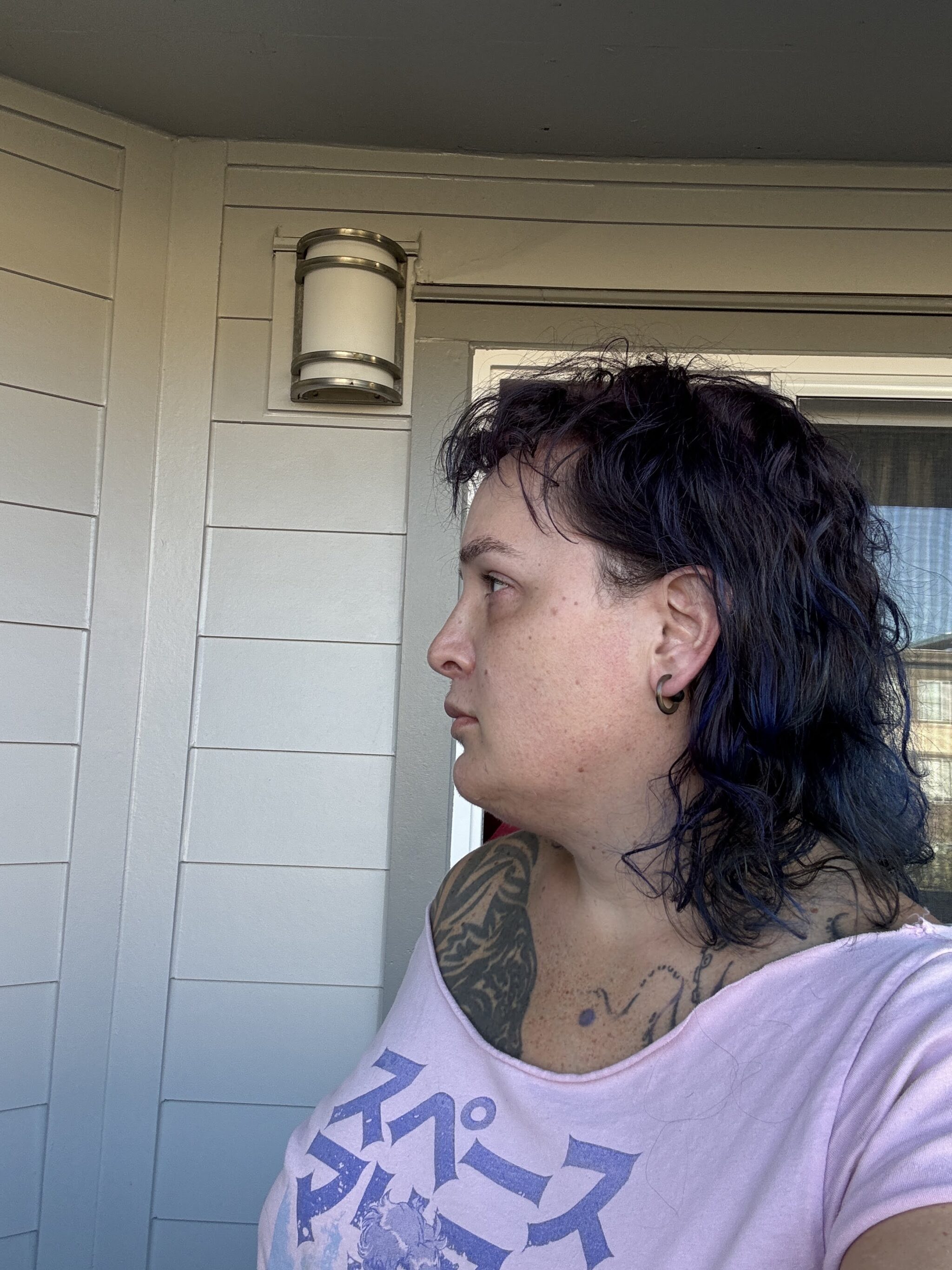 Corry Frydlewicz selfie 9/30/2026 with a neutral face and no makeup -- side view