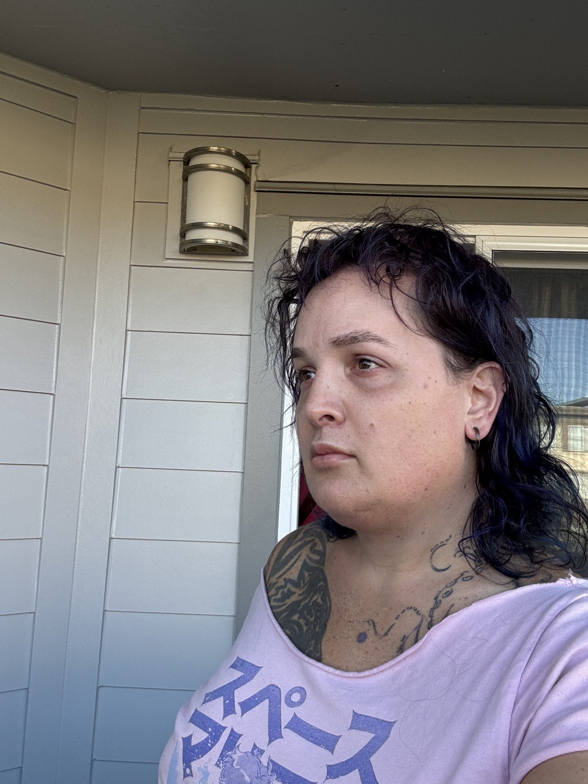 Corry Frydlewicz selfie 9/30/2026 with a neutral face and no makeup -- halfway side view