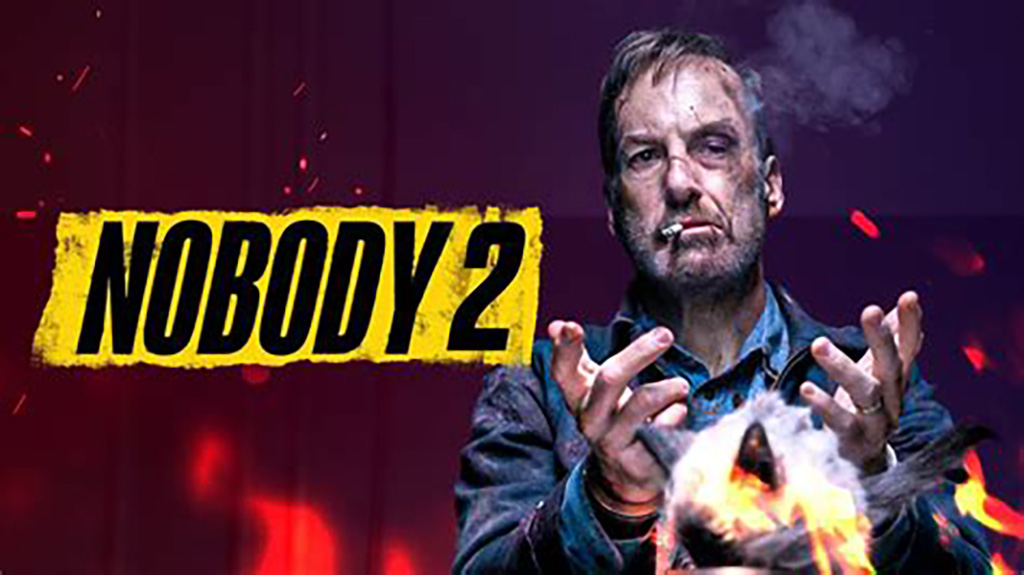 Nobody 2 movie banner with the main character appearing beat up, smoking a cigarette and setting something on fire.